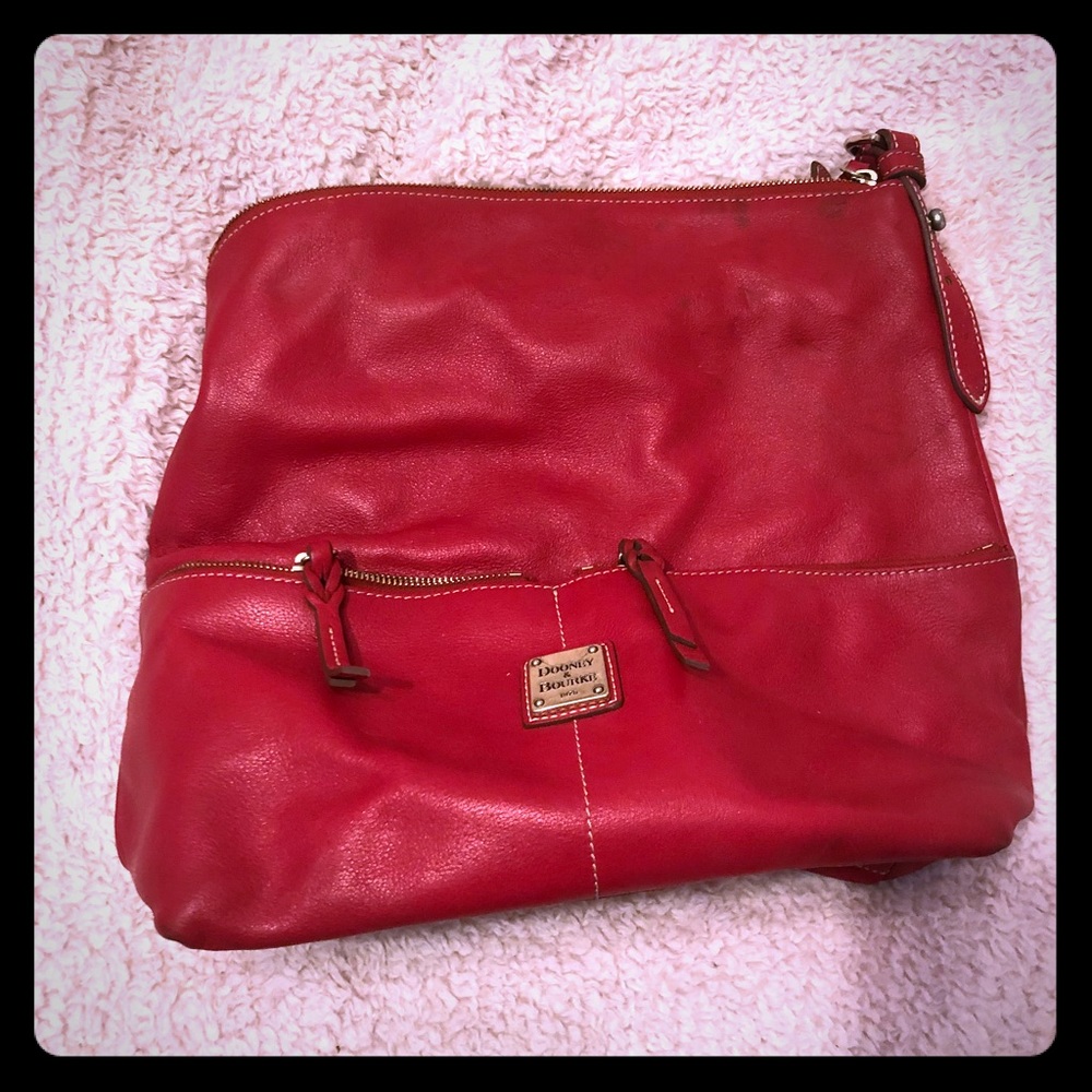 Red leather Dooney. Two front zipper pockets